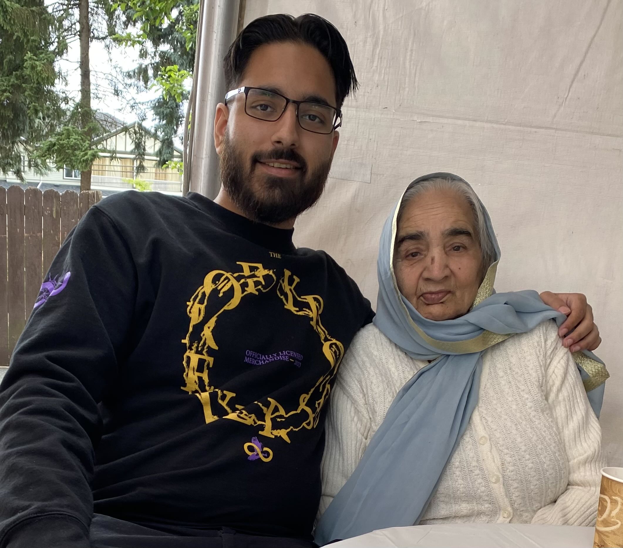 Picture of me sitting next to my grandmother